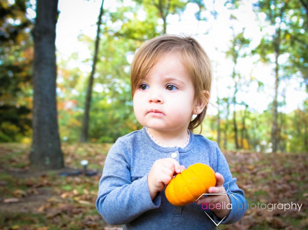 holding a pumpkin