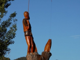 man caught trout statue